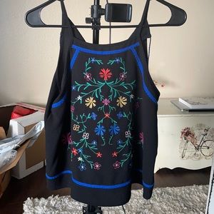 Embroidered cami top. Flowy fit.